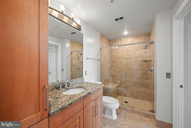 full bath with visible vents, a stall shower, and vanity