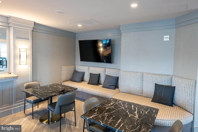 carpeted living area featuring recessed lighting and visible vents