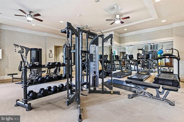 workout area with carpet flooring, a ceiling fan, and crown molding