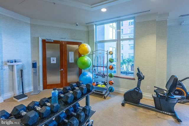 workout area featuring baseboards, carpet flooring, and ornamental molding