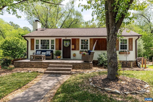 1014 Holmes Ave, Charlottesville, VA 22901 - ranch-style home featuring a porch, a shingled roof, and a chimney