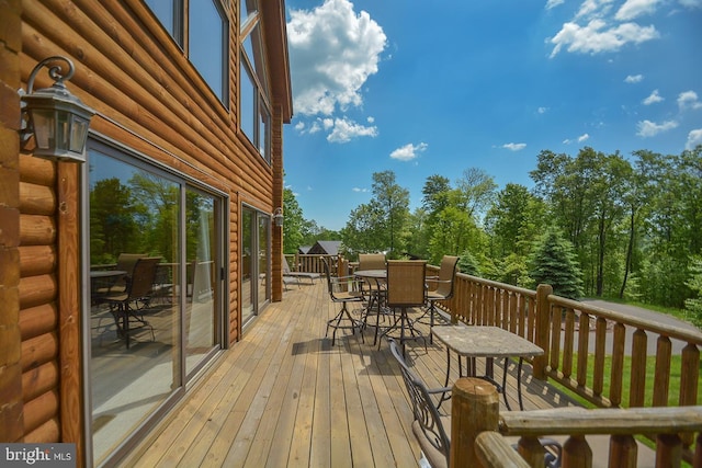 deck featuring outdoor dining area