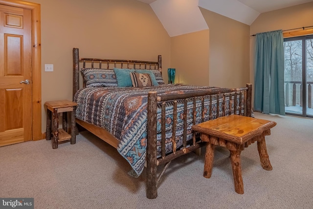 carpeted bedroom with access to outside and lofted ceiling