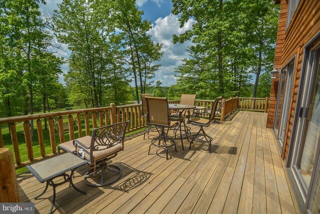 deck featuring outdoor dining area