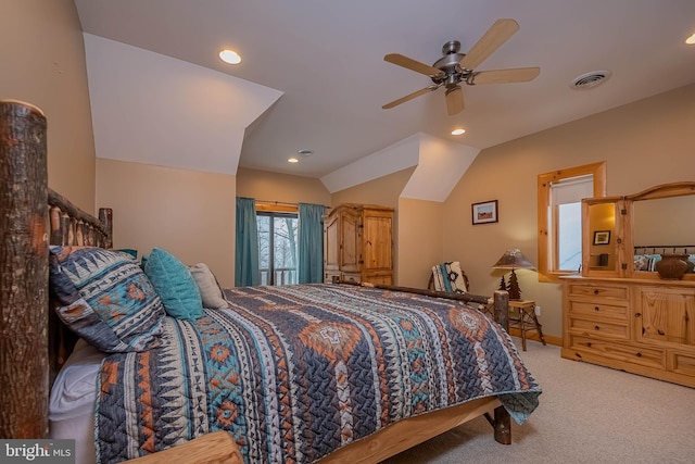 carpeted bedroom featuring visible vents, recessed lighting, a ceiling fan, and vaulted ceiling