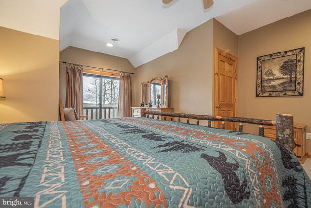 bedroom with a ceiling fan and lofted ceiling