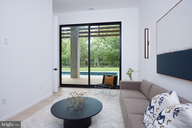 living area featuring baseboards