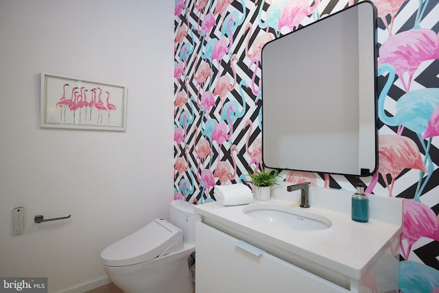 bathroom with toilet and vanity