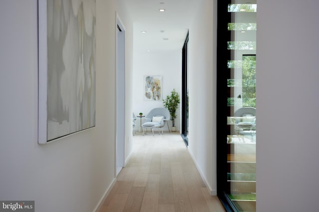 hallway with light wood-type flooring