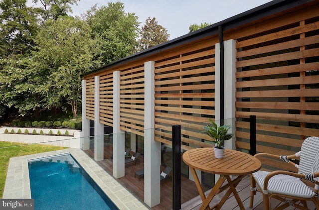 exterior space with a fenced in pool