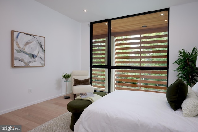 bedroom featuring recessed lighting, baseboards, and wood finished floors