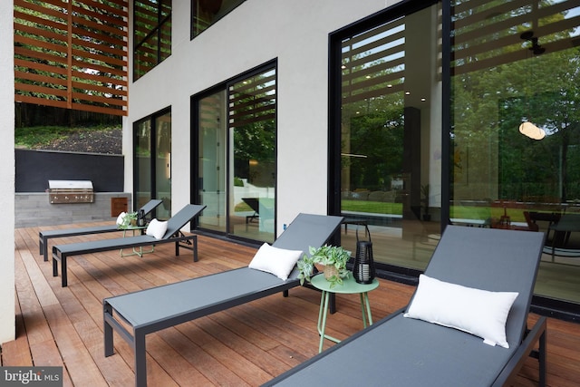 deck featuring exterior kitchen and area for grilling