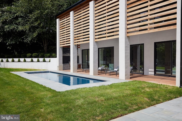view of pool featuring a lawn, fence, a fenced in pool, and a patio