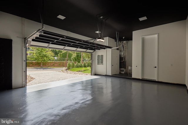 garage featuring a garage door opener and electric panel