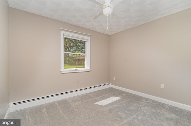spare room with carpet flooring, a ceiling fan, baseboards, and baseboard heating