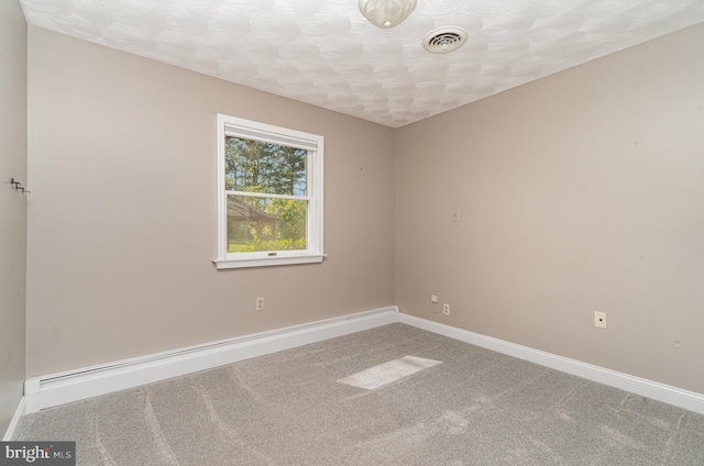 unfurnished room with carpet flooring, a textured ceiling, visible vents, baseboards, and a baseboard radiator