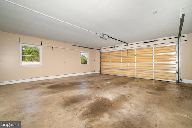 garage featuring baseboards and a garage door opener