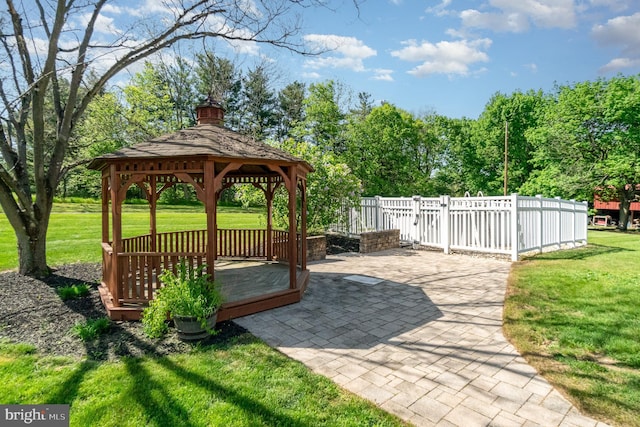 view of yard featuring fence, a gazebo, and a patio area