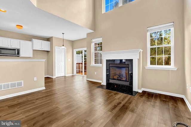 9 Ryan Ct, Telford, PA 18969 - unfurnished living room with a wealth of natural light, dark wood finished floors, and visible vents