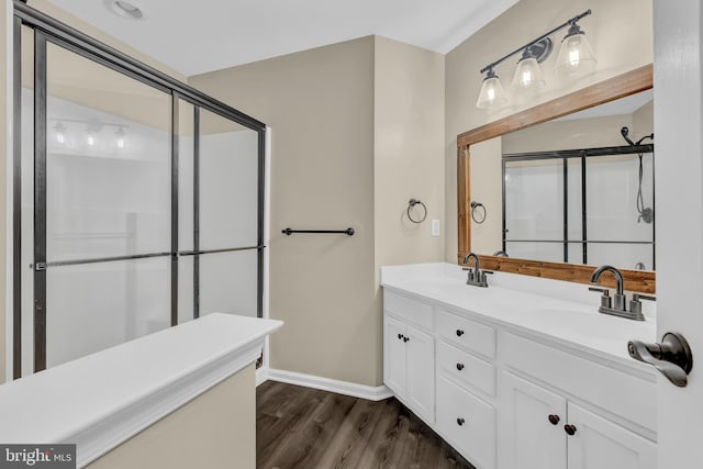 9 Ryan Ct, Telford, PA 18969 - bathroom featuring baseboards, a shower with door, a sink, and wood finished floors