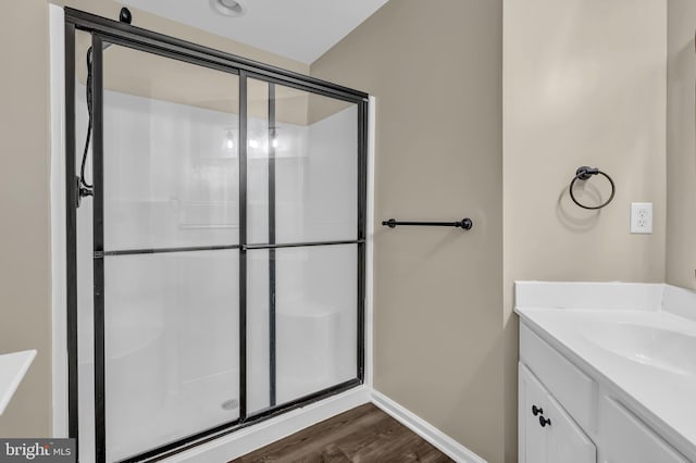 9 Ryan Ct, Telford, PA 18969 - bathroom featuring vanity, baseboards, wood finished floors, and a shower stall