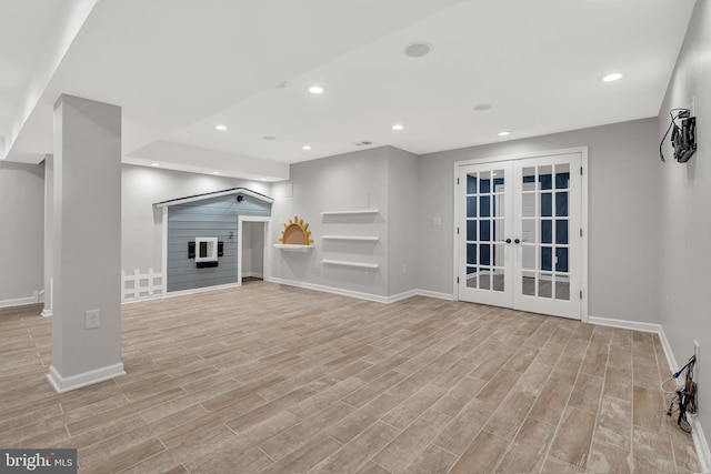 9 Ryan Ct, Telford, PA 18969 - unfurnished living room with french doors, recessed lighting, light wood-style flooring, baseboards, and a glass covered fireplace