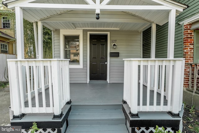 property entrance with covered porch