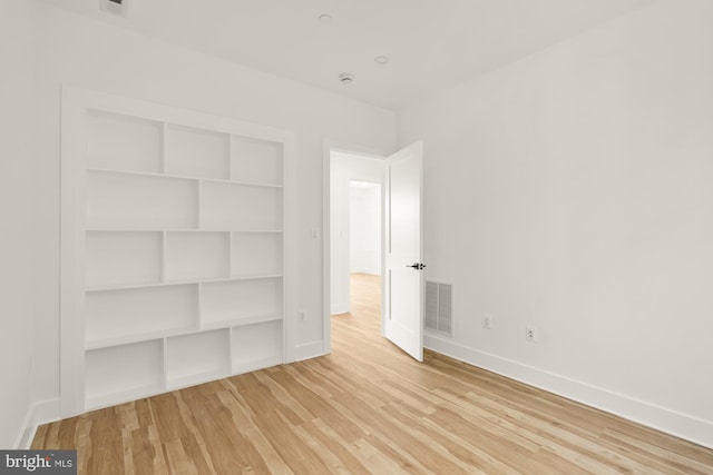 1251 Morse St NE Unit Ph3, Washington, DC 20002 - unfurnished bedroom with visible vents, baseboards, a closet, and light wood-type flooring