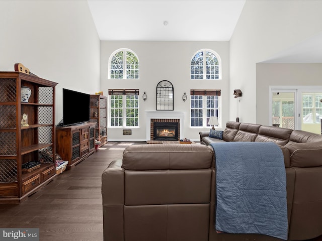 8283 Waterford Mill Ct, Pasadena, MD 21122 - living room with a high ceiling, a brick fireplace, and dark wood-type flooring