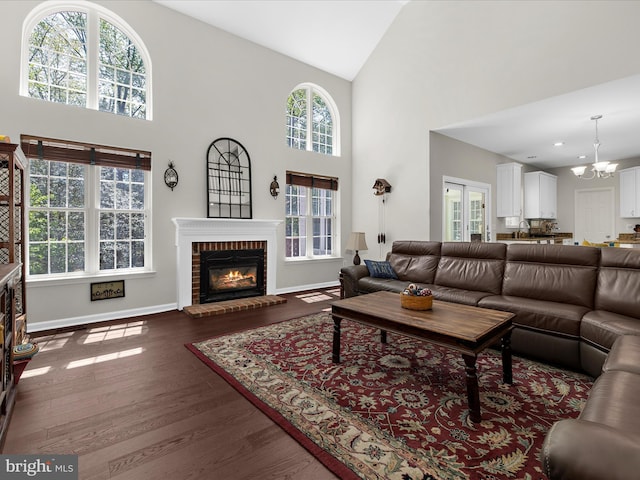 8283 Waterford Mill Ct, Pasadena, MD 21122 - living room featuring high vaulted ceiling and a healthy amount of sunlight