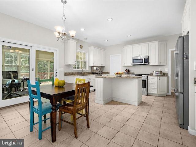 8283 Waterford Mill Ct, Pasadena, MD 21122 - dining area featuring recessed lighting, light tile patterned floors, and a chandelier