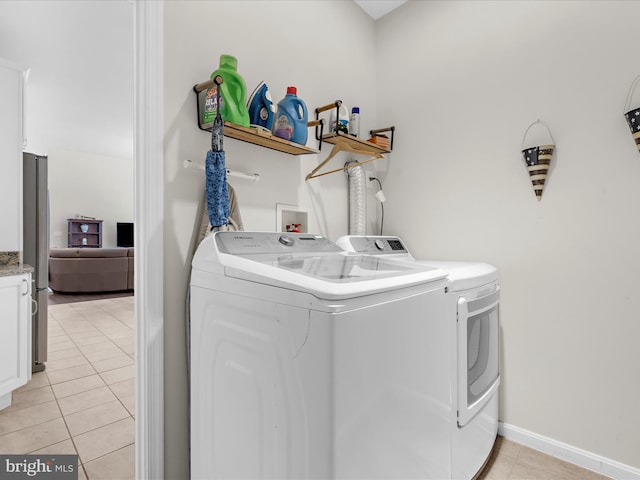 8283 Waterford Mill Ct, Pasadena, MD 21122 - laundry room with baseboards, separate washer and dryer, laundry area, and light tile patterned flooring