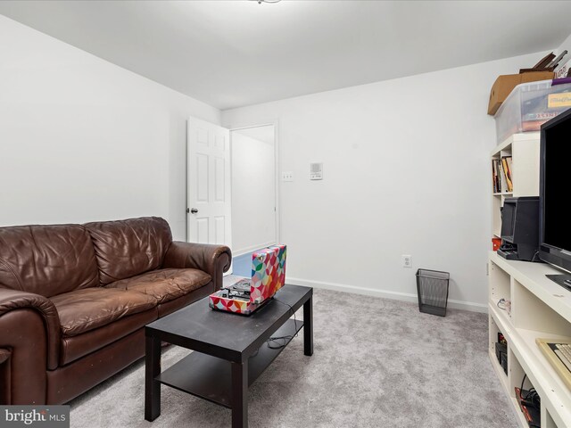 8283 Waterford Mill Ct, Pasadena, MD 21122 - living area with baseboards and light colored carpet