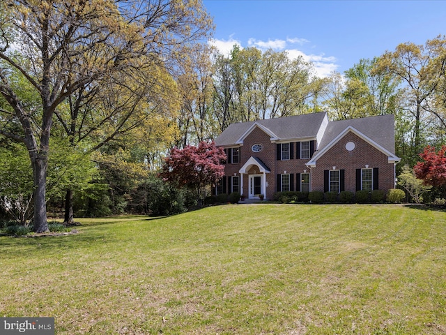 8283 Waterford Mill Ct, Pasadena, MD 21122 - colonial-style house with a front yard and brick siding