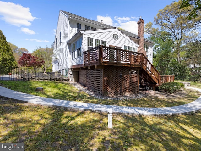8283 Waterford Mill Ct, Pasadena, MD 21122 - rear view of house with fence, stairs, a deck, a chimney, and a yard