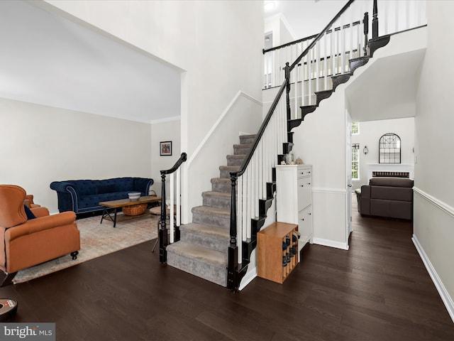 8283 Waterford Mill Ct, Pasadena, MD 21122 - stairs with baseboards, a high ceiling, ornamental molding, and wood finished floors