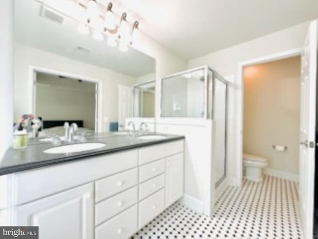 2206 Greywing St, Woodbridge, VA 22191 - full bath featuring a shower stall, toilet, double vanity, and baseboards
