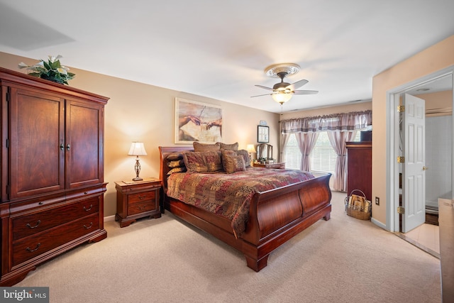 bedroom with baseboards, ceiling fan, and light carpet