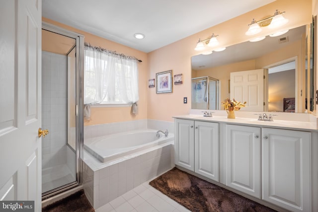 bathroom with a sink, double vanity, tile patterned floors, a shower stall, and a bath