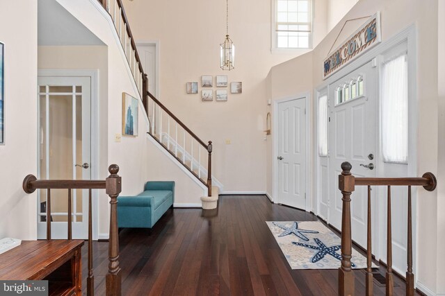 5229 Woodleaf Ct, Centreville, VA 20120 - foyer with hardwood / wood-style flooring, a towering ceiling, stairs, and baseboards