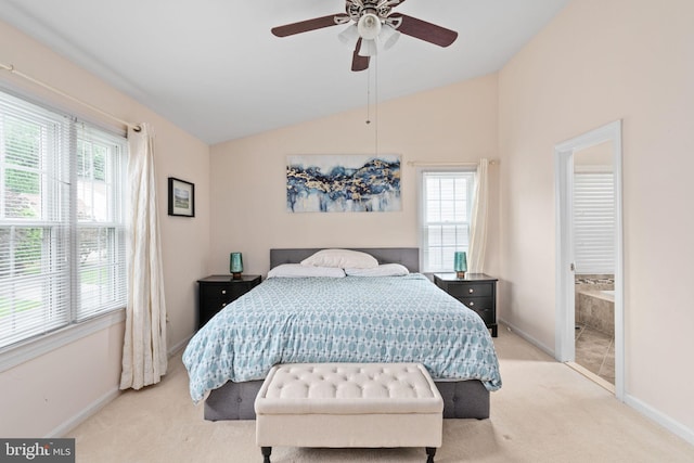 5229 Woodleaf Ct, Centreville, VA 20120 - carpeted bedroom with multiple windows, baseboards, lofted ceiling, ensuite bathroom, and a ceiling fan