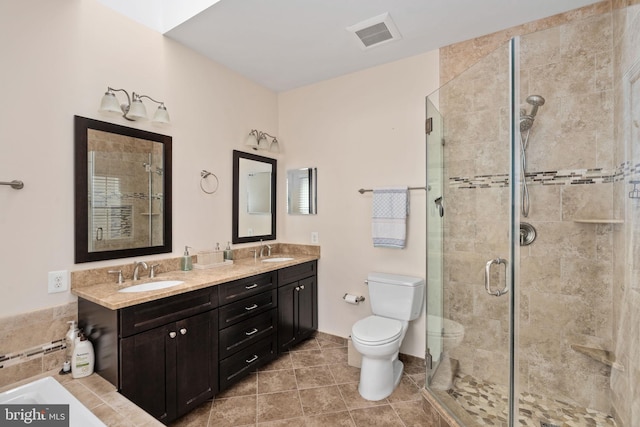 5229 Woodleaf Ct, Centreville, VA 20120 - full bathroom featuring a shower stall, toilet, double vanity, and tile patterned floors