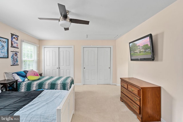 5229 Woodleaf Ct, Centreville, VA 20120 - bedroom with attic access, multiple closets, light colored carpet, baseboards, and ceiling fan