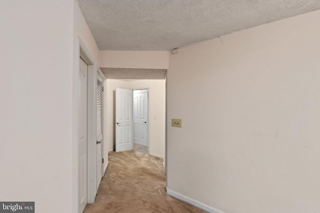 5229 Woodleaf Ct, Centreville, VA 20120 - hall featuring a textured ceiling, light colored carpet, and baseboards