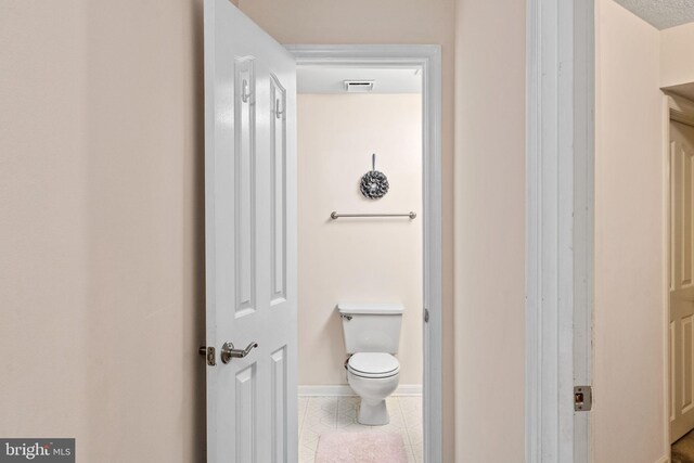 5229 Woodleaf Ct, Centreville, VA 20120 - bathroom featuring toilet, tile patterned floors, and baseboards