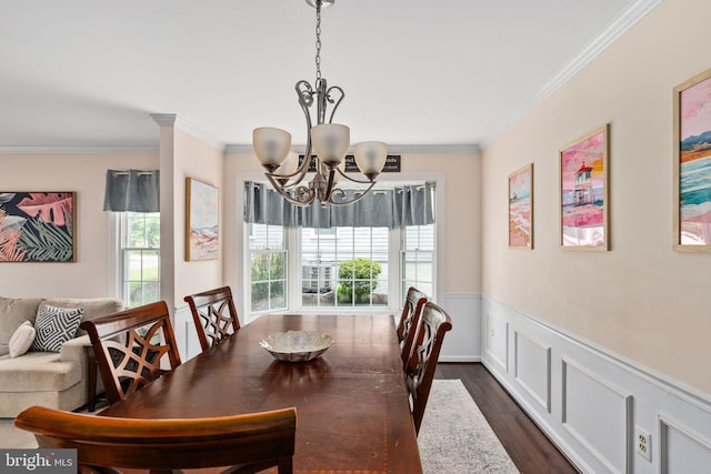 5229 Woodleaf Ct, Centreville, VA 20120 - dining space featuring a chandelier, plenty of natural light, crown molding, a wainscoted wall, and dark wood finished floors