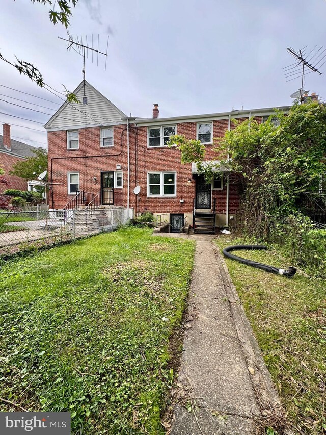 1333 E Northern Pkwy, Baltimore, MD 21239 - back of property with brick siding and a chimney