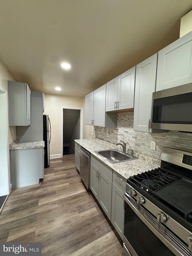 1333 E Northern Pkwy, Baltimore, MD 21239 - kitchen featuring appliances with stainless steel finishes, a sink, light countertops, backsplash, and recessed lighting
