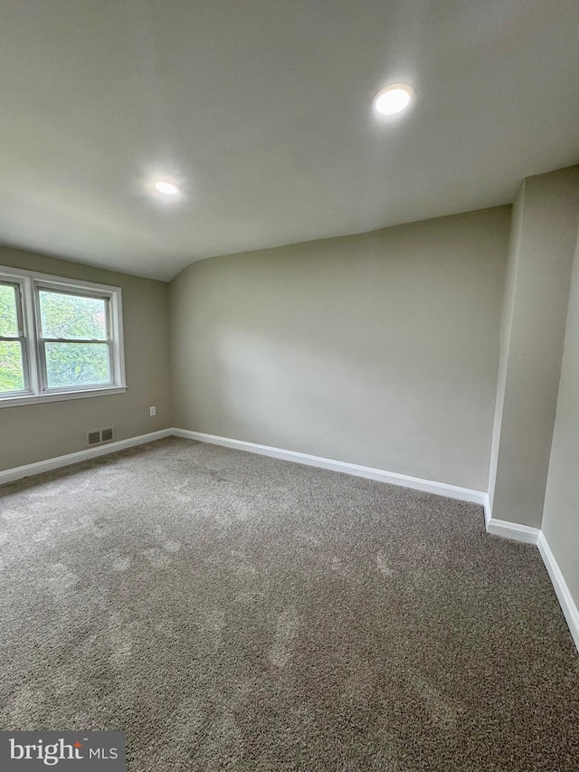 1333 E Northern Pkwy, Baltimore, MD 21239 - carpeted empty room with baseboards and recessed lighting