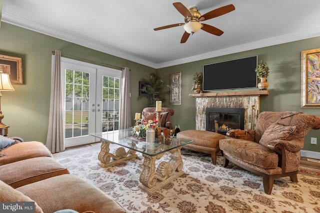 3219 Sunset Ave, Norristown, PA 19403 - living room with french doors, wood finished floors, ceiling fan, ornamental molding, and a stone fireplace